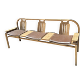 Baumann bench with wooden frame and faux leather seat.