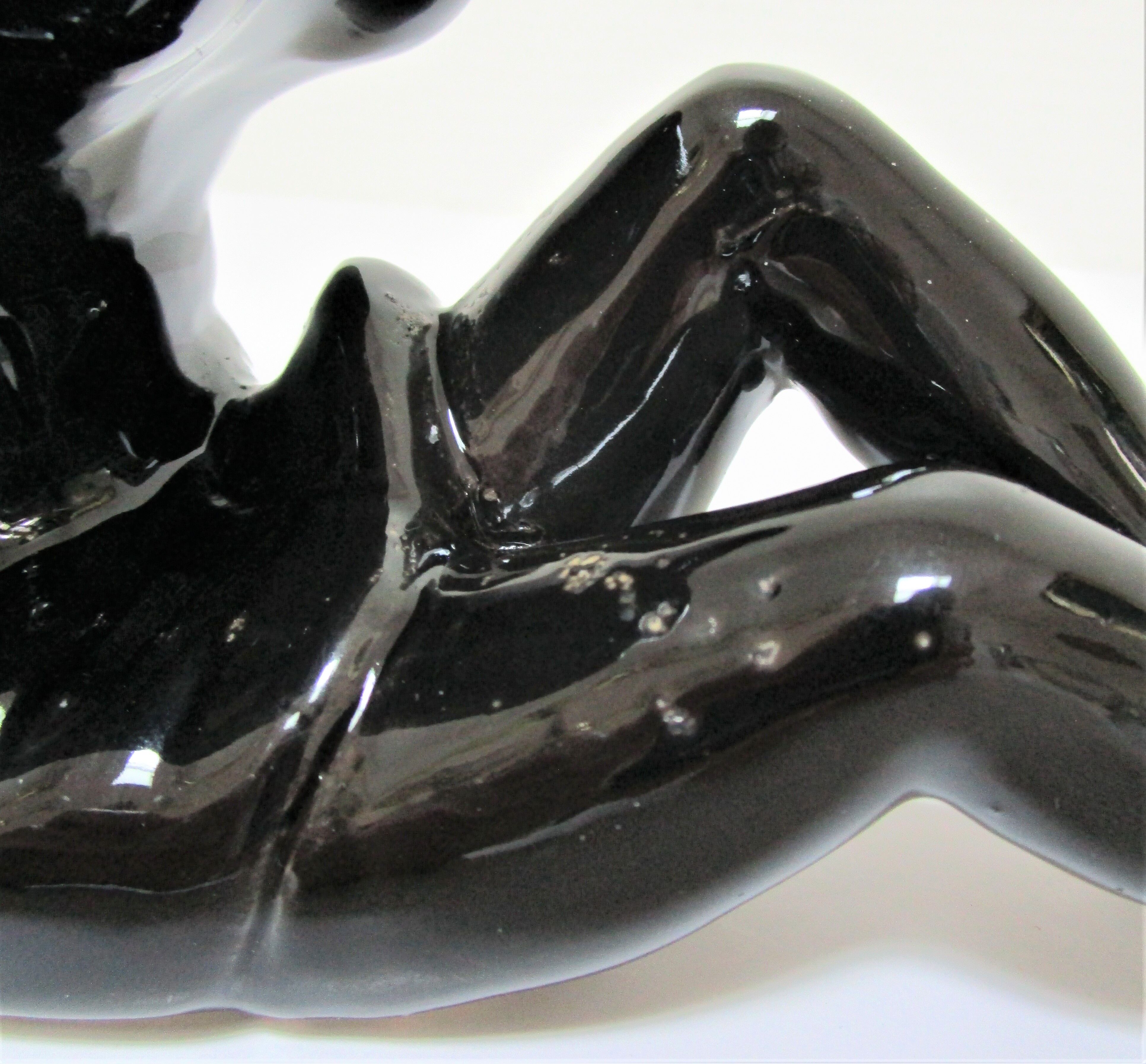 Anthropomorphic ashtray legs ceramic black design 80s
