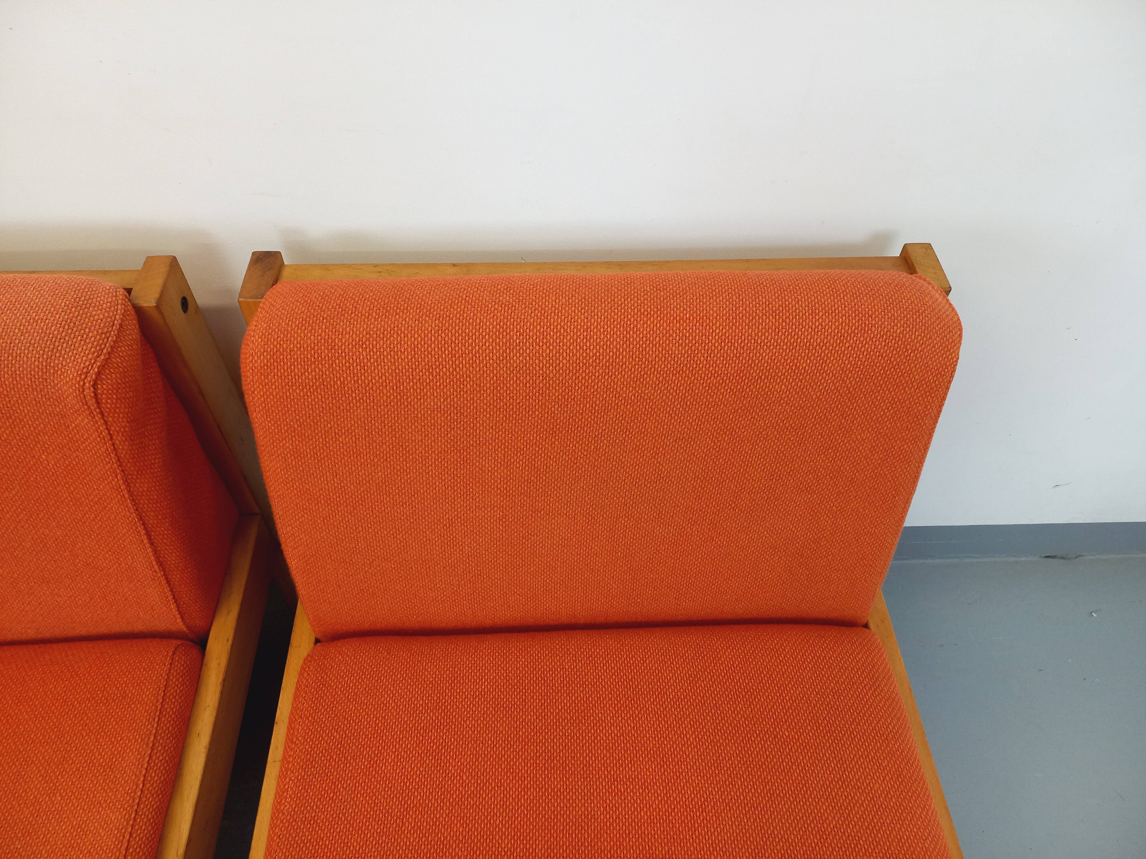 Set of 2 vintage Baumann armchairs in orange fabric and wood from the 80s