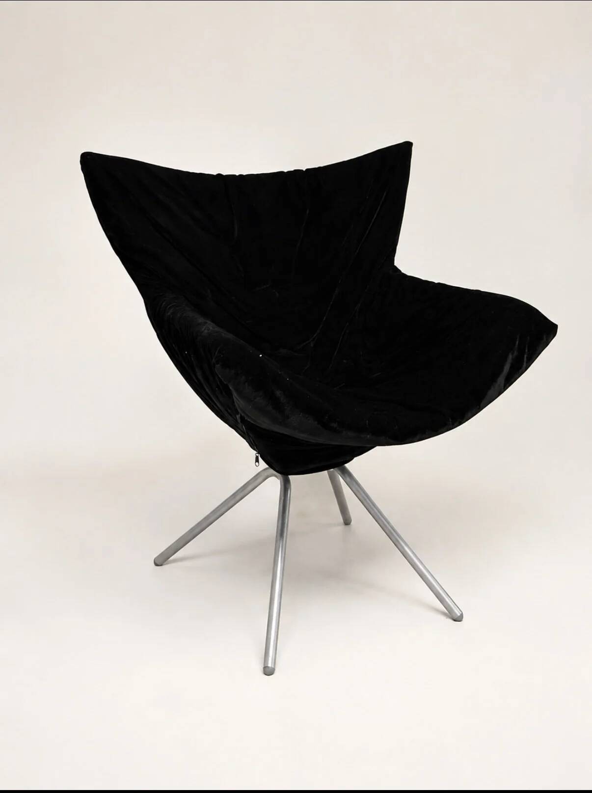 Vintage black velvet swivel lounge chair, sculptural butterfly shape.