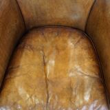 Club chair made of sheepskin leather with the most beautiful colors and a stunning patina