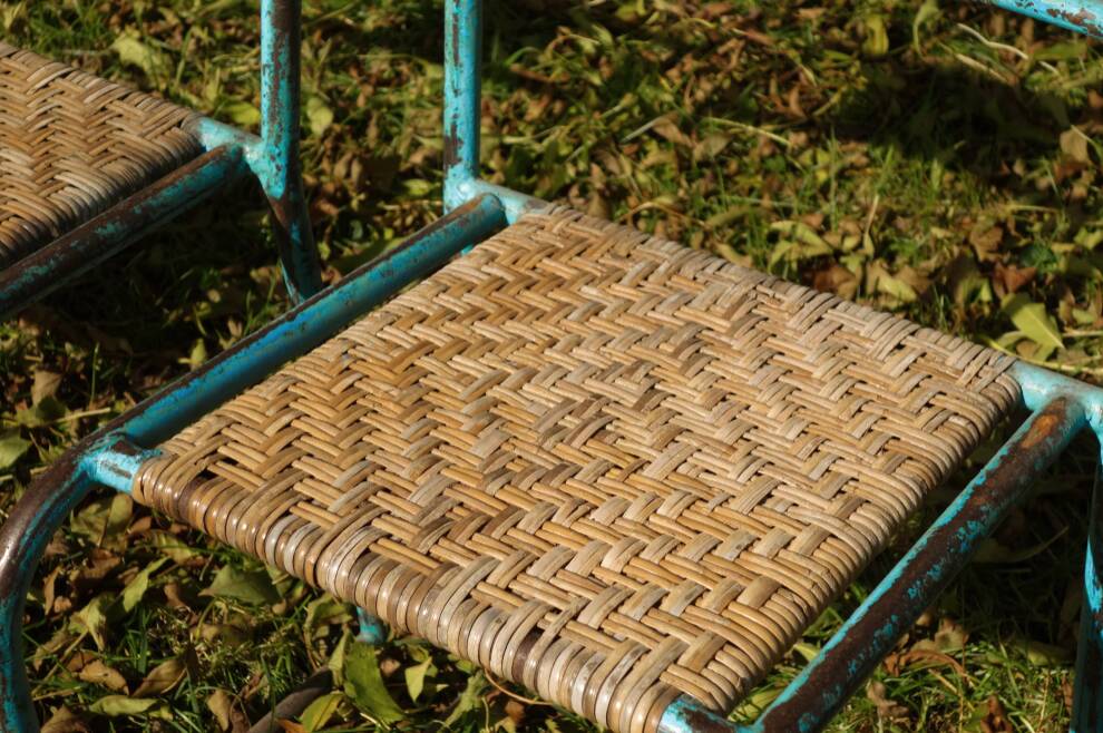Wrought iron and rattan garden chairs