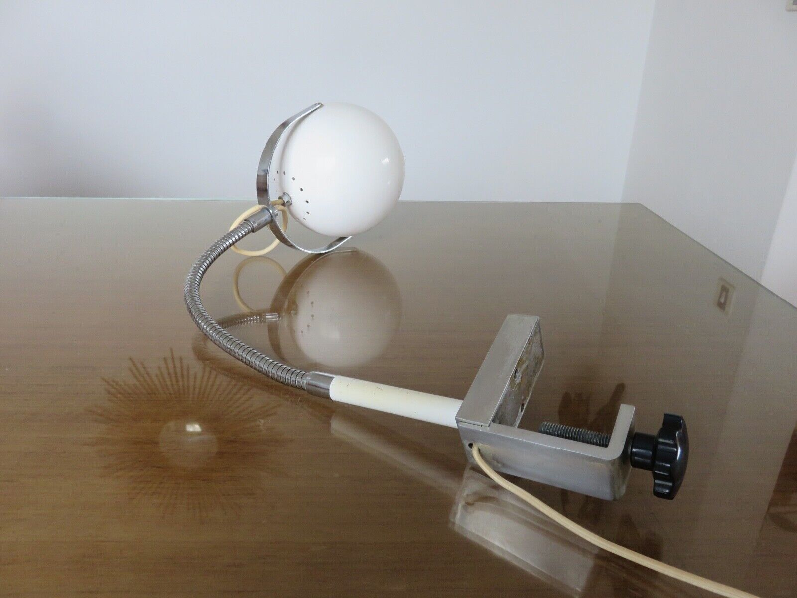 Eye ball lamp stapled on a chrome hose 70s