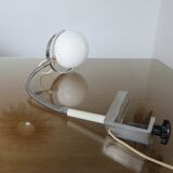 Eye ball lamp stapled on a chrome hose 70s