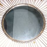 Round sun mirror with pearl rays and leaves