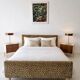 Vintage leopard print bed frame, Hollywood Regency style.