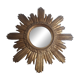 Vintage sun mirror in gilded wood. 1960