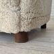 Fauteuil danois des années 1960, en véritable peau de mouton "Canberra", retapissé.