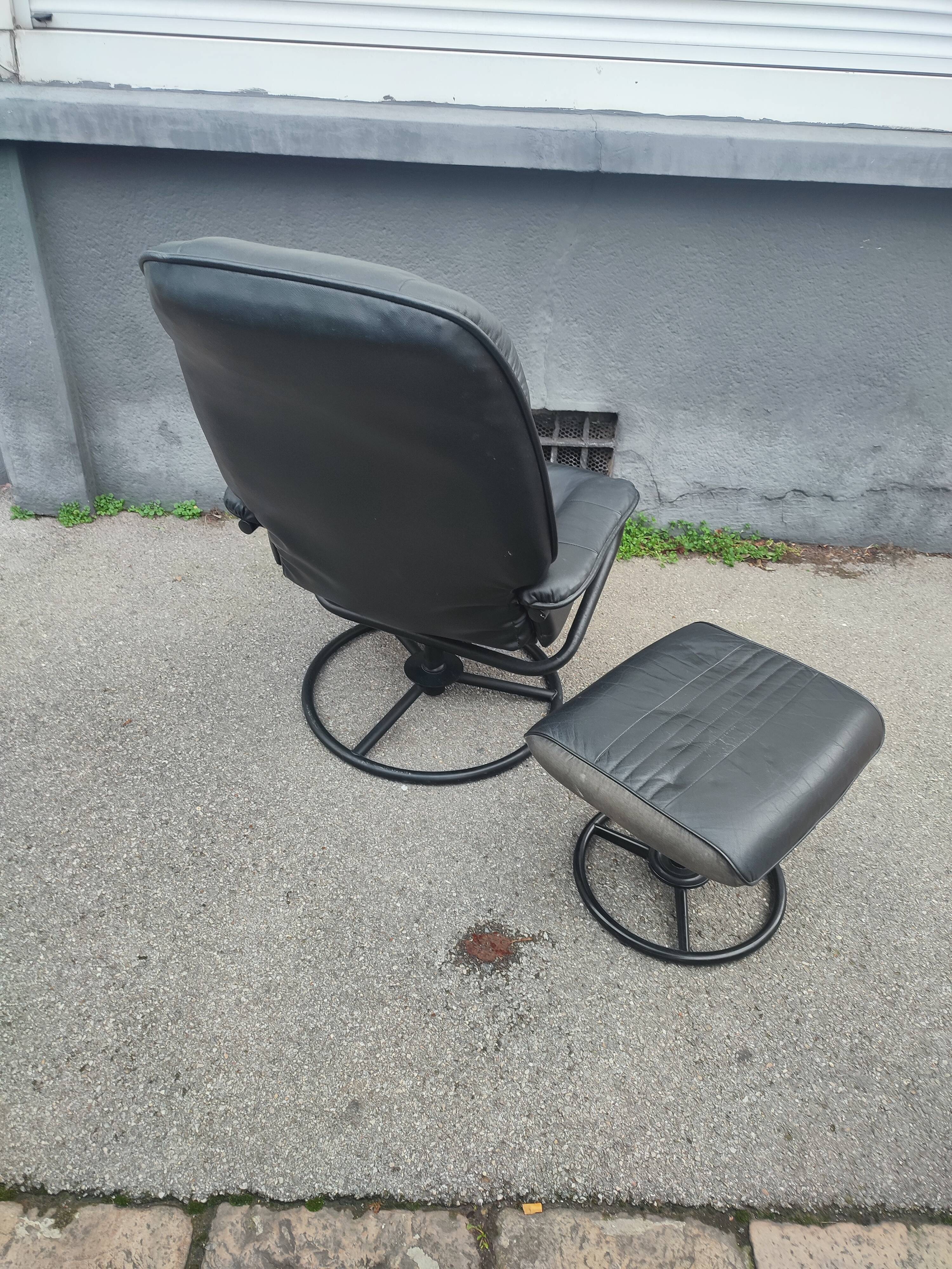 Scandinavian design leather armchair and footrest