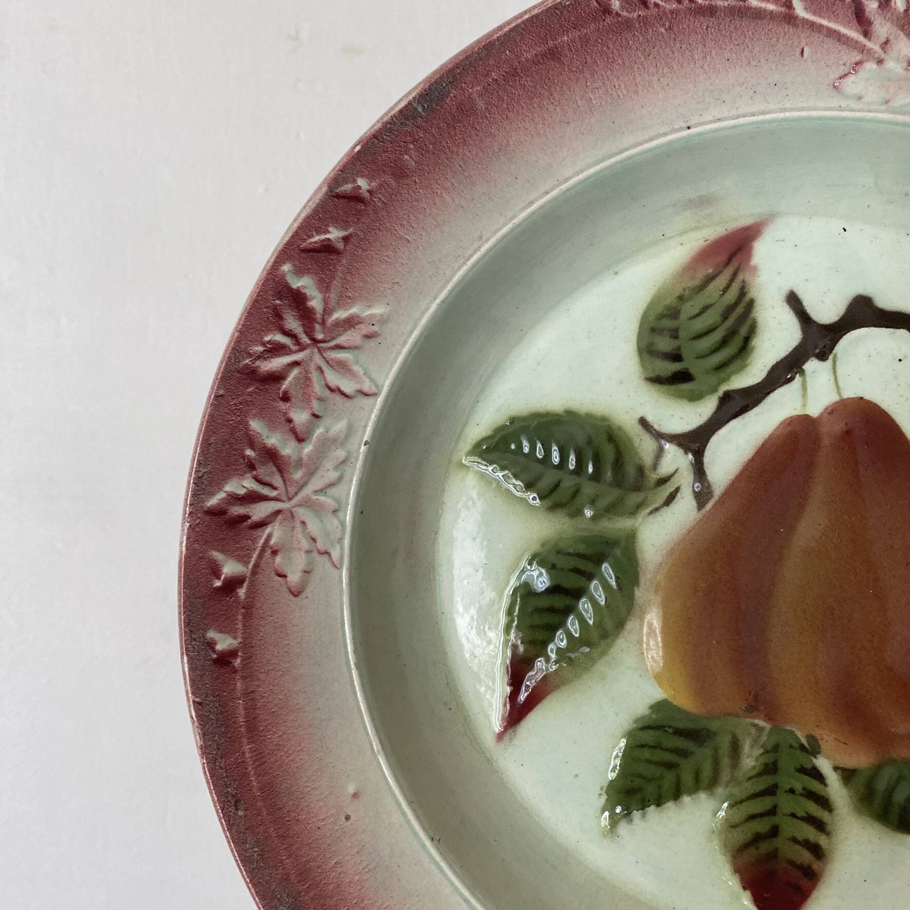 Antique shallow dish in slipware with pear decoration.
