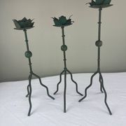 Sculptural candle holder trio
