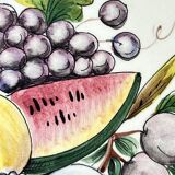 Decorative earthenware and pewter wall plate with fruits