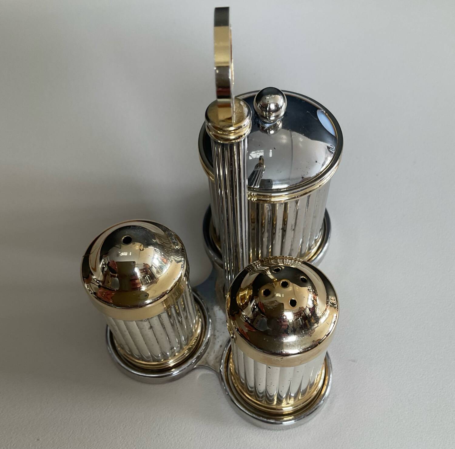 Vintage metal silver-plated and brass salt and pepper set.
