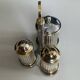 Vintage metal silver-plated and brass salt and pepper set.