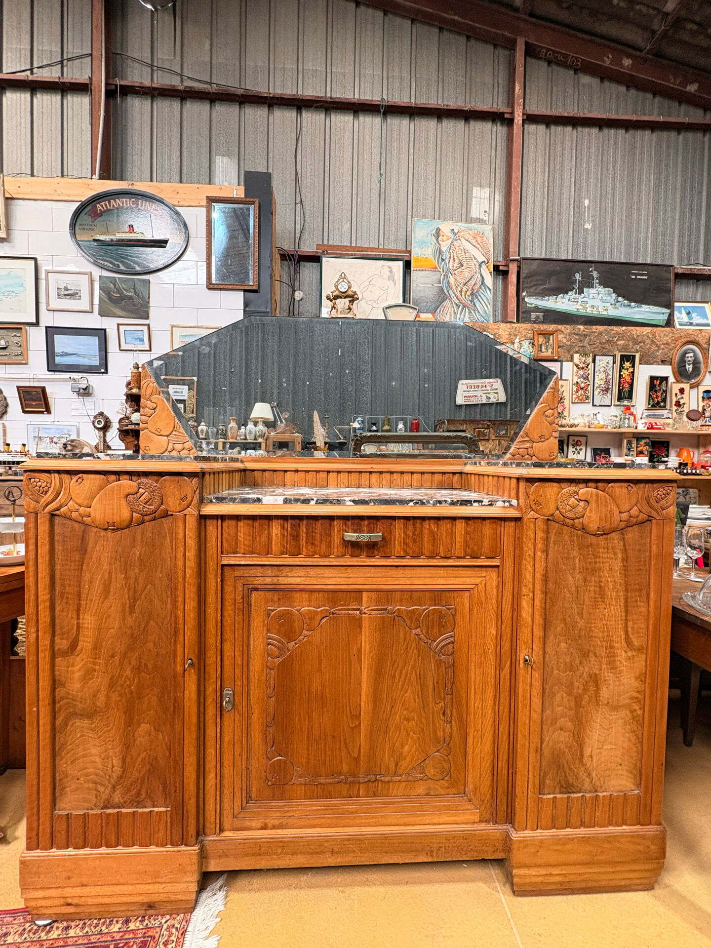Art Deco buffet in carved walnut, marble and large mirror – 1930s