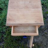 Raw wood bedside table