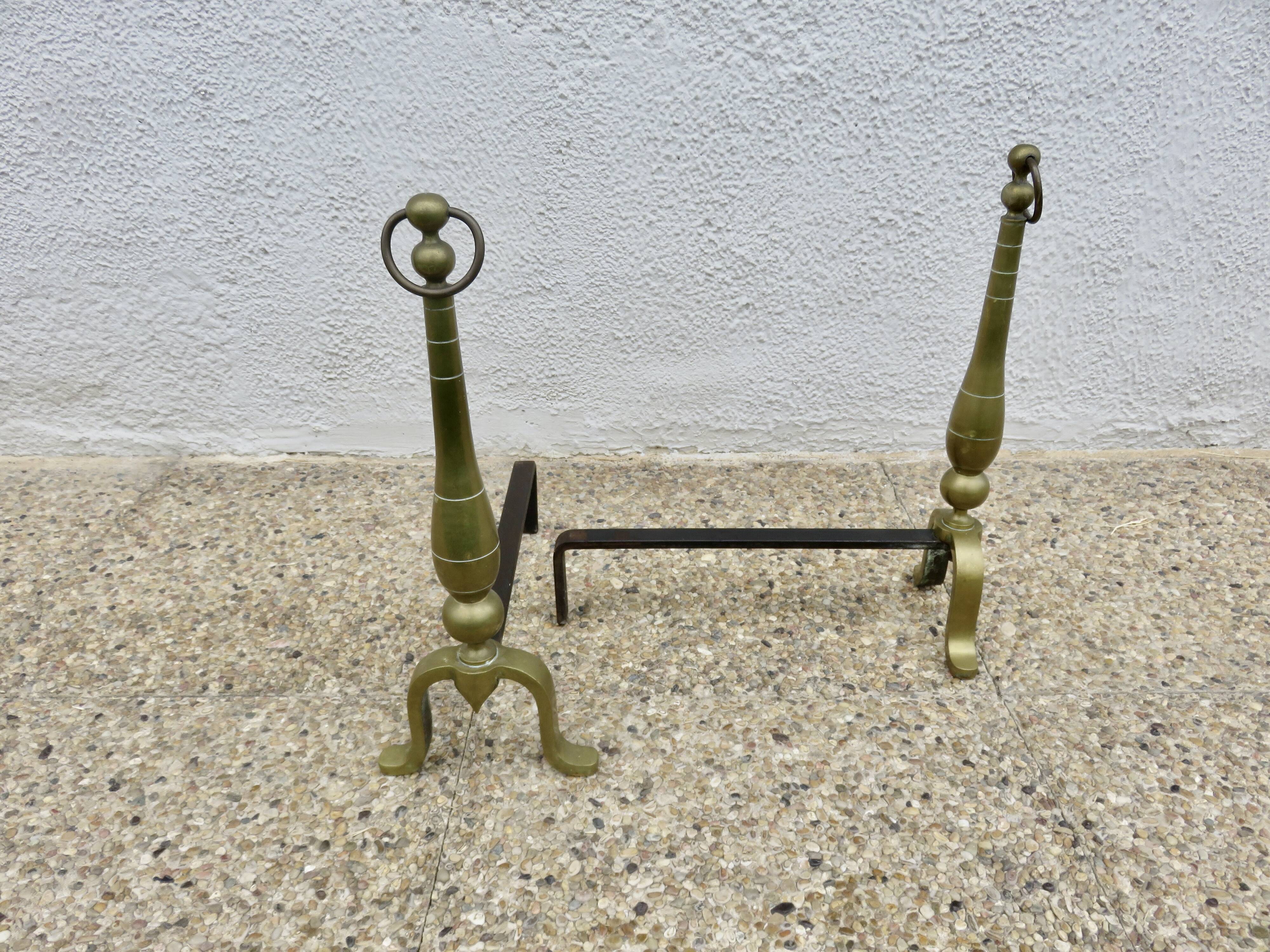 Pair of Neo-classical andirons, in solid bronze, 1920s-1930s.