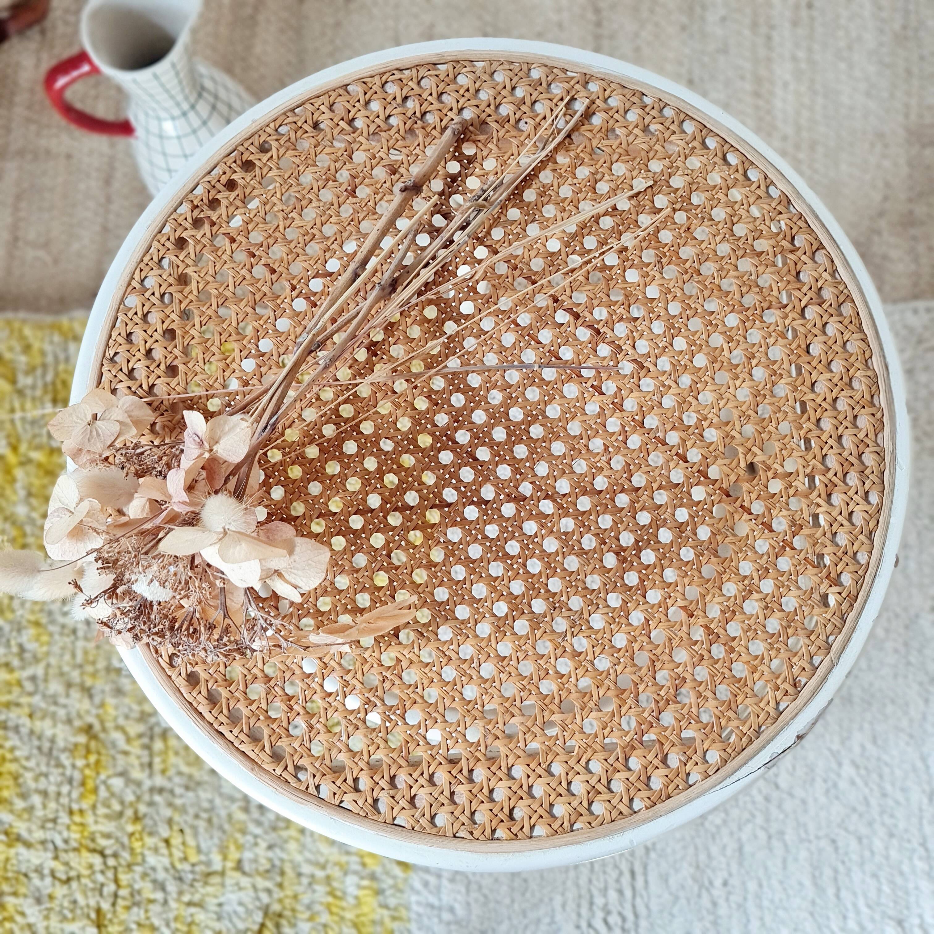 Antique stool with wood and cream caning.