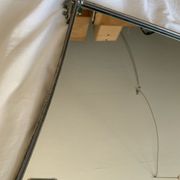 Miroir en metal argenté bord incurvé