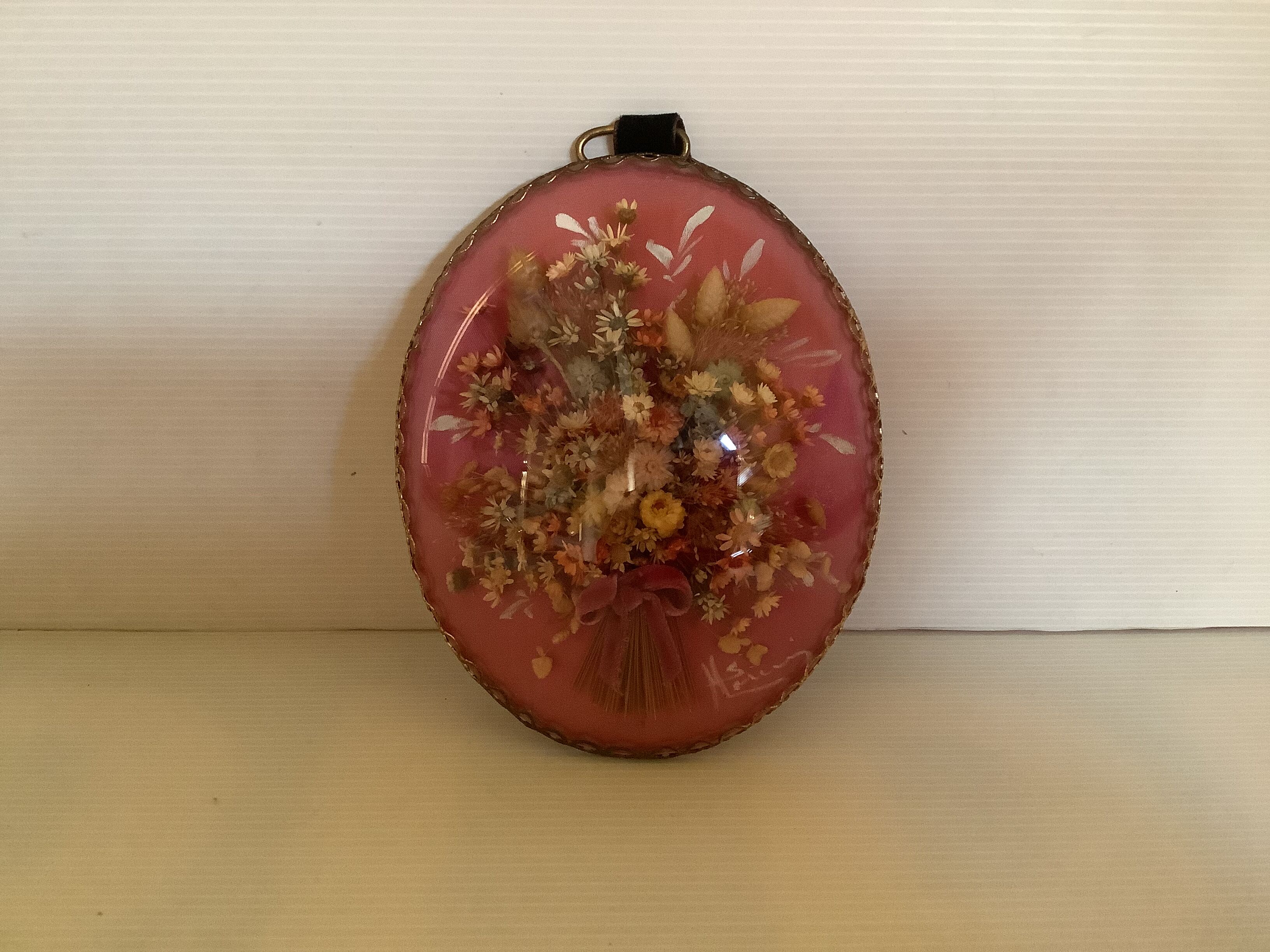 Old vintage oval dried flowers frame