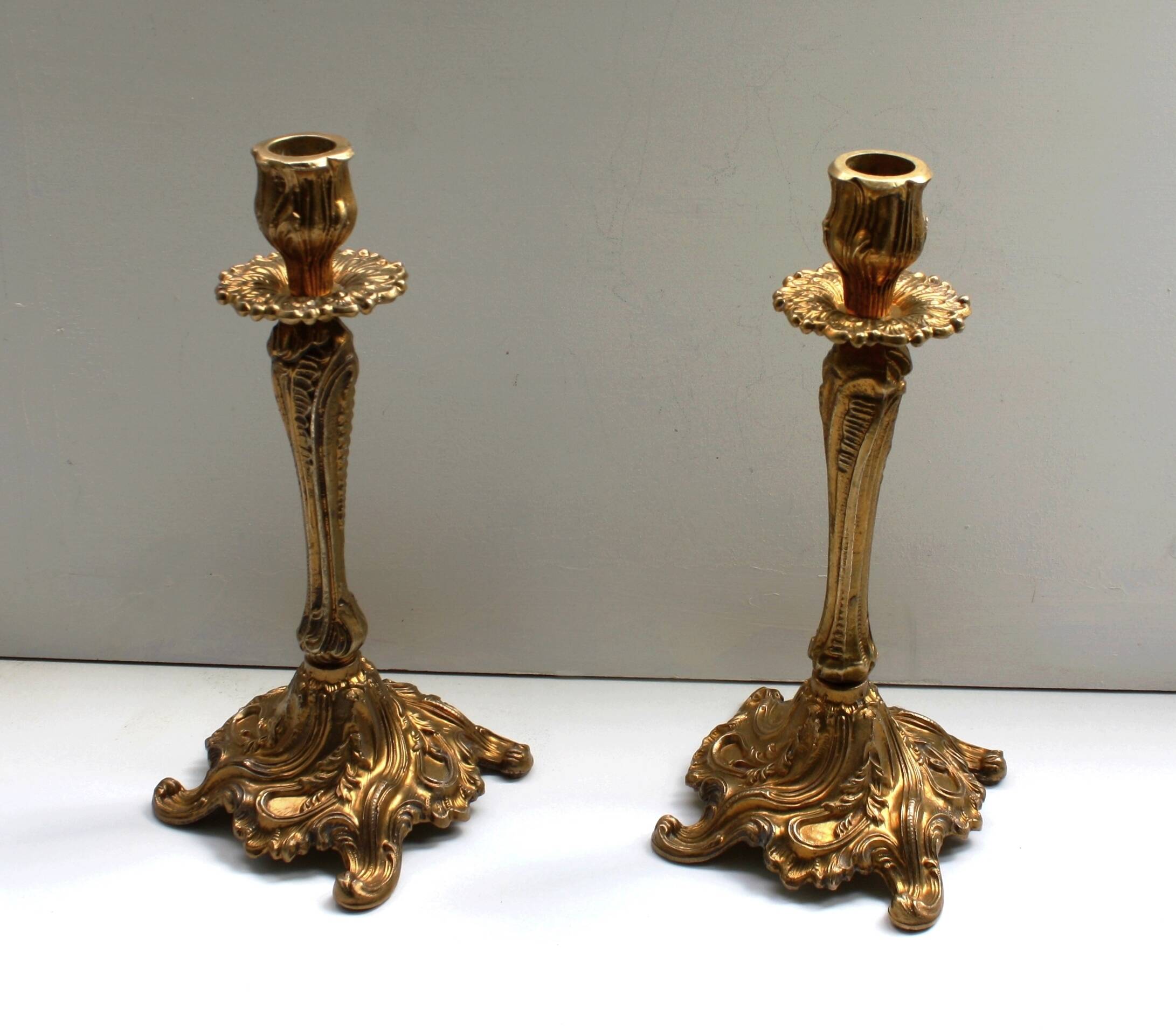 Pairs of Louis XV style gilded bronze candlesticks