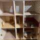 Large wooden dollhouse with miniature furniture