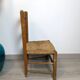 Vintage wooden and straw children's chair in a country style.