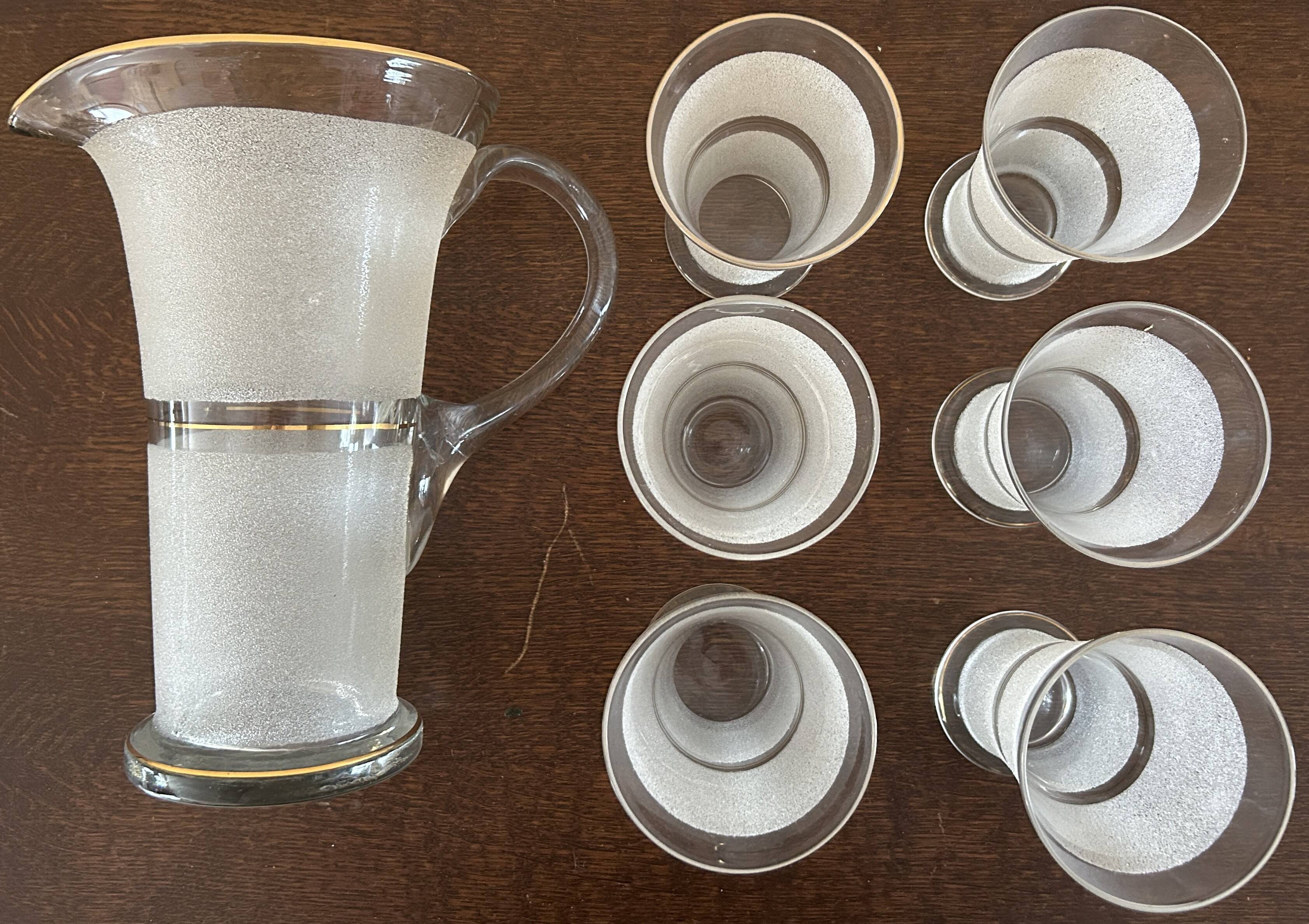 Jug + 6 frosted glass tumblers with white and gold rim.