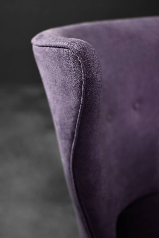 High-backed wing chair in oak and purple fabric, vintage Scandinavian style from the 1950s.