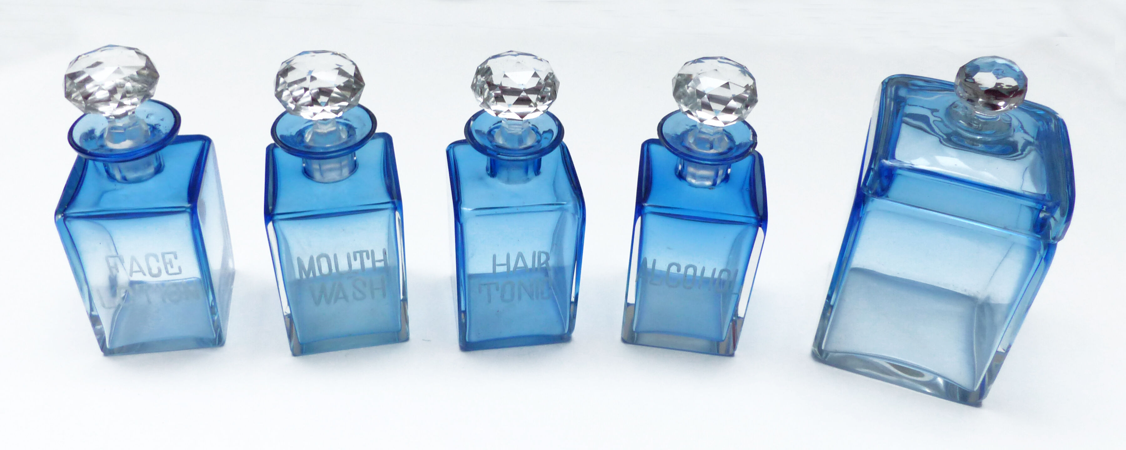 Set of 5 sapphire blue Bohemian crystal toilet bottles.