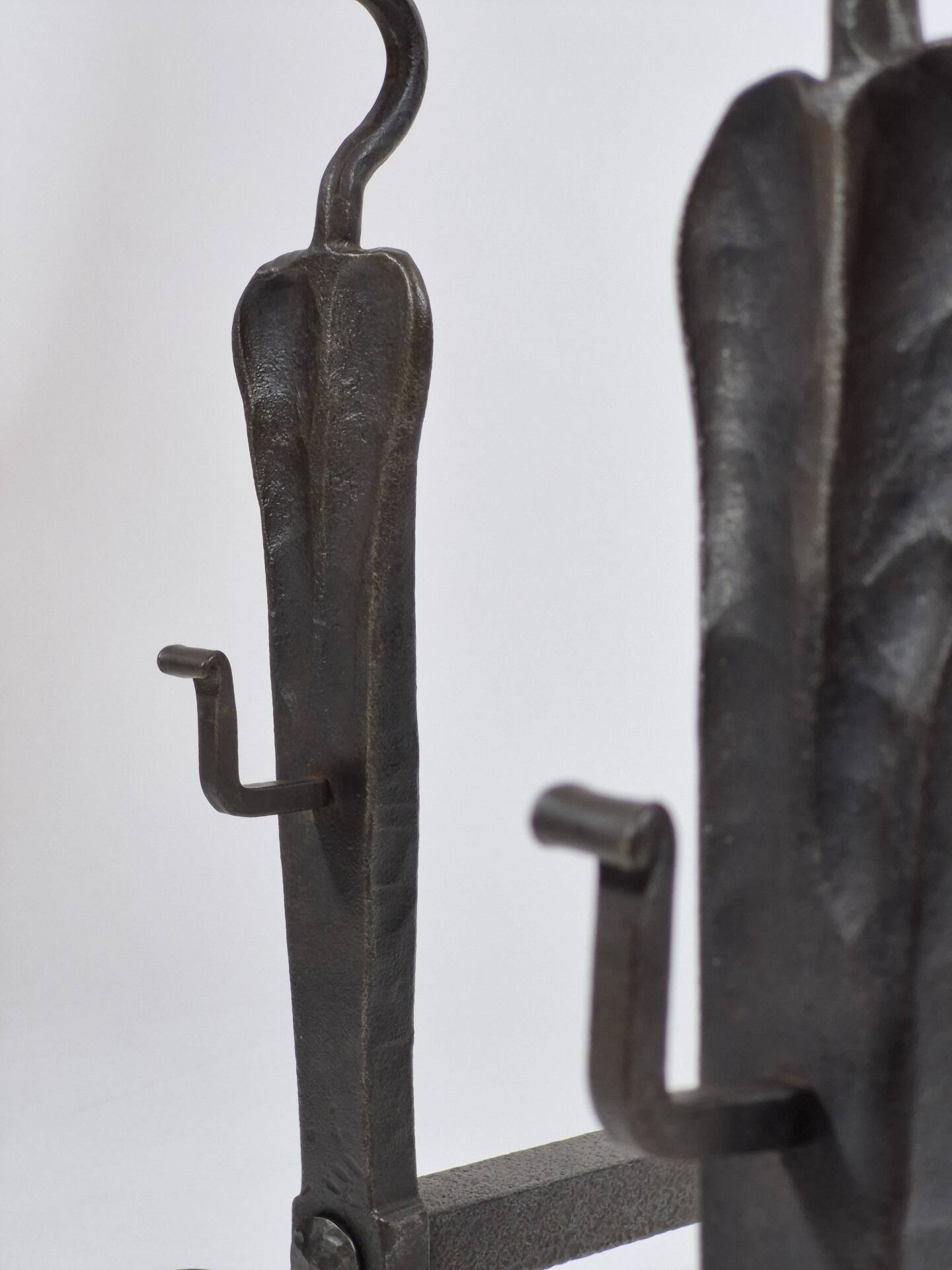 Pair of handforged metal and brass andirons