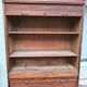 Vintage 1940s secretary desk with wooden curtains, storage, and shutters.