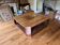 Varnished coffee table in exotic wood