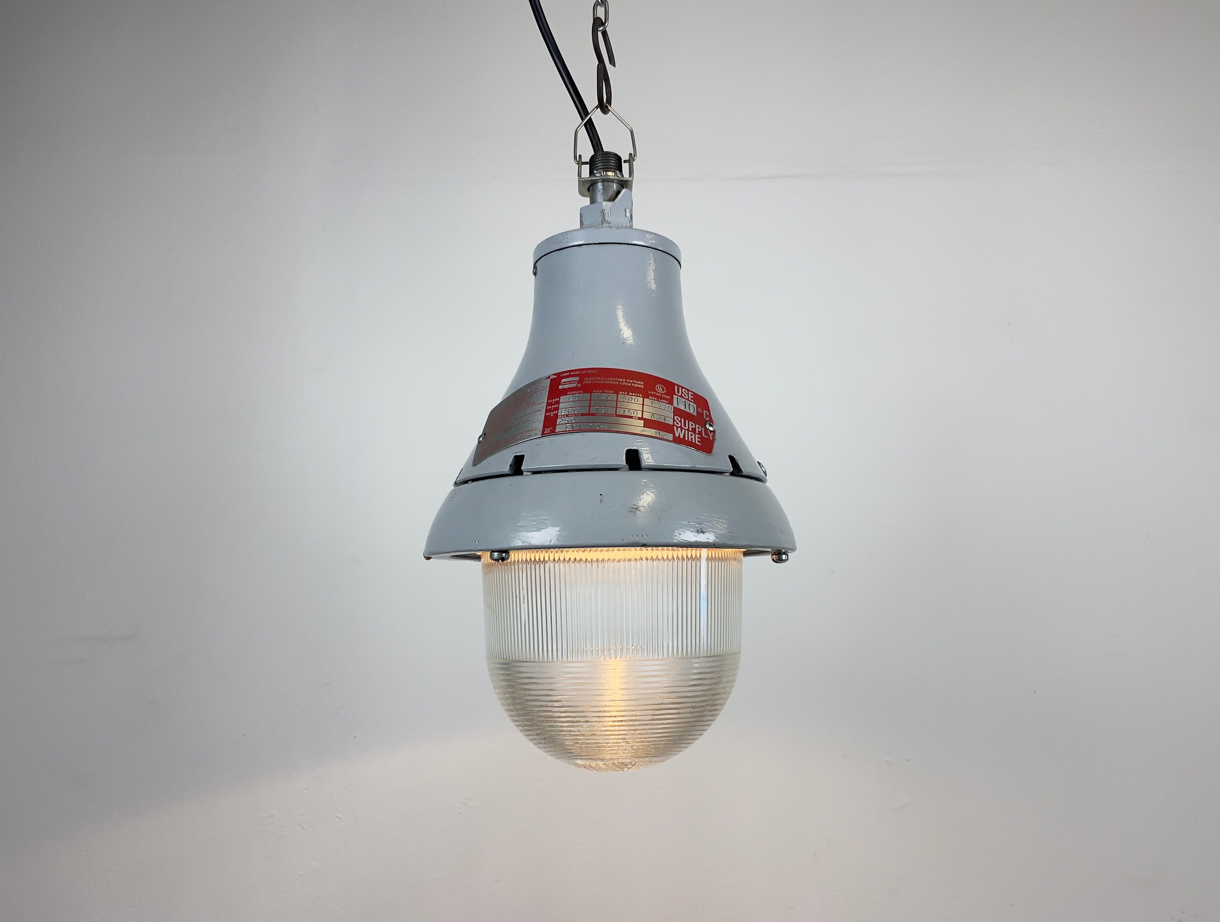 Grey industrial explosion proof light from Crouse-Hinds, 1970s