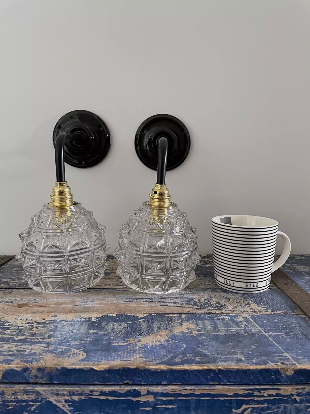 Set of two chiseled glass sconces