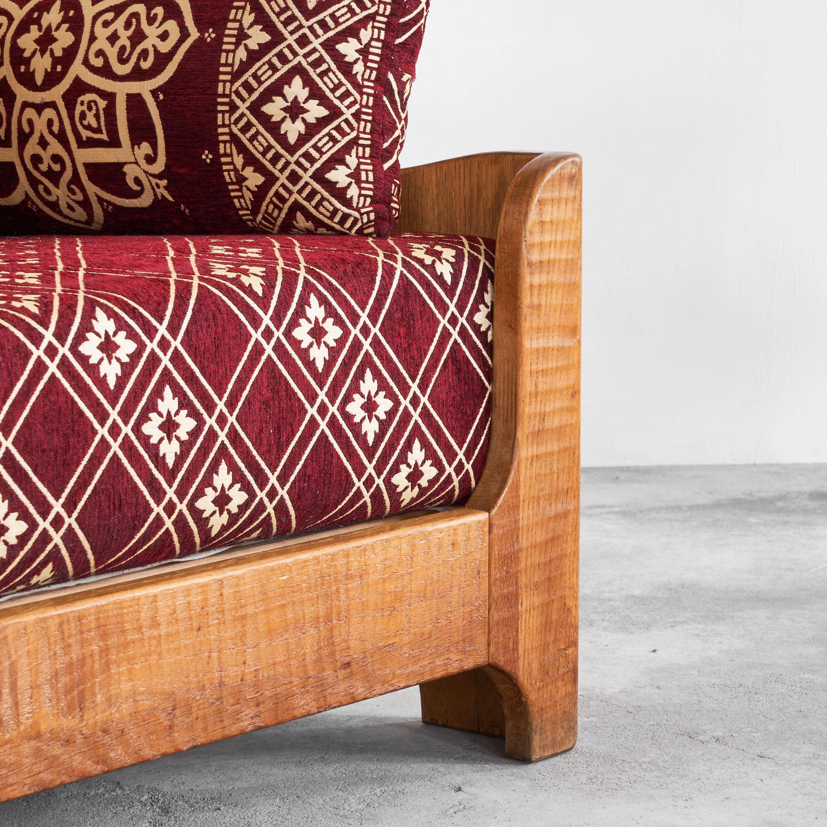 Sculptural lounge chair in solid oak from the 1940s.