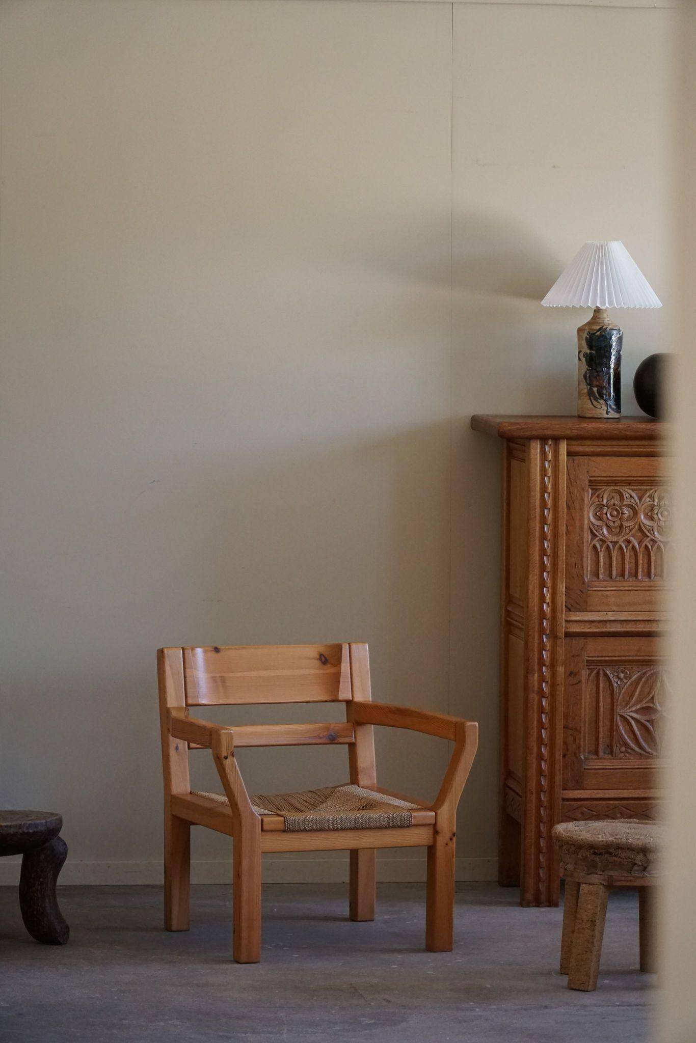 Tage Poulsen, a pair of brutalist chairs in pine and cord, Danish modern style, 1970s.