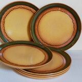 Six vintage stoneware plates with green net