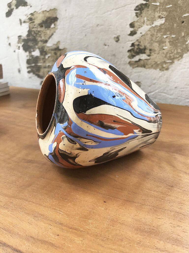 Vase dripping in varnished earth
