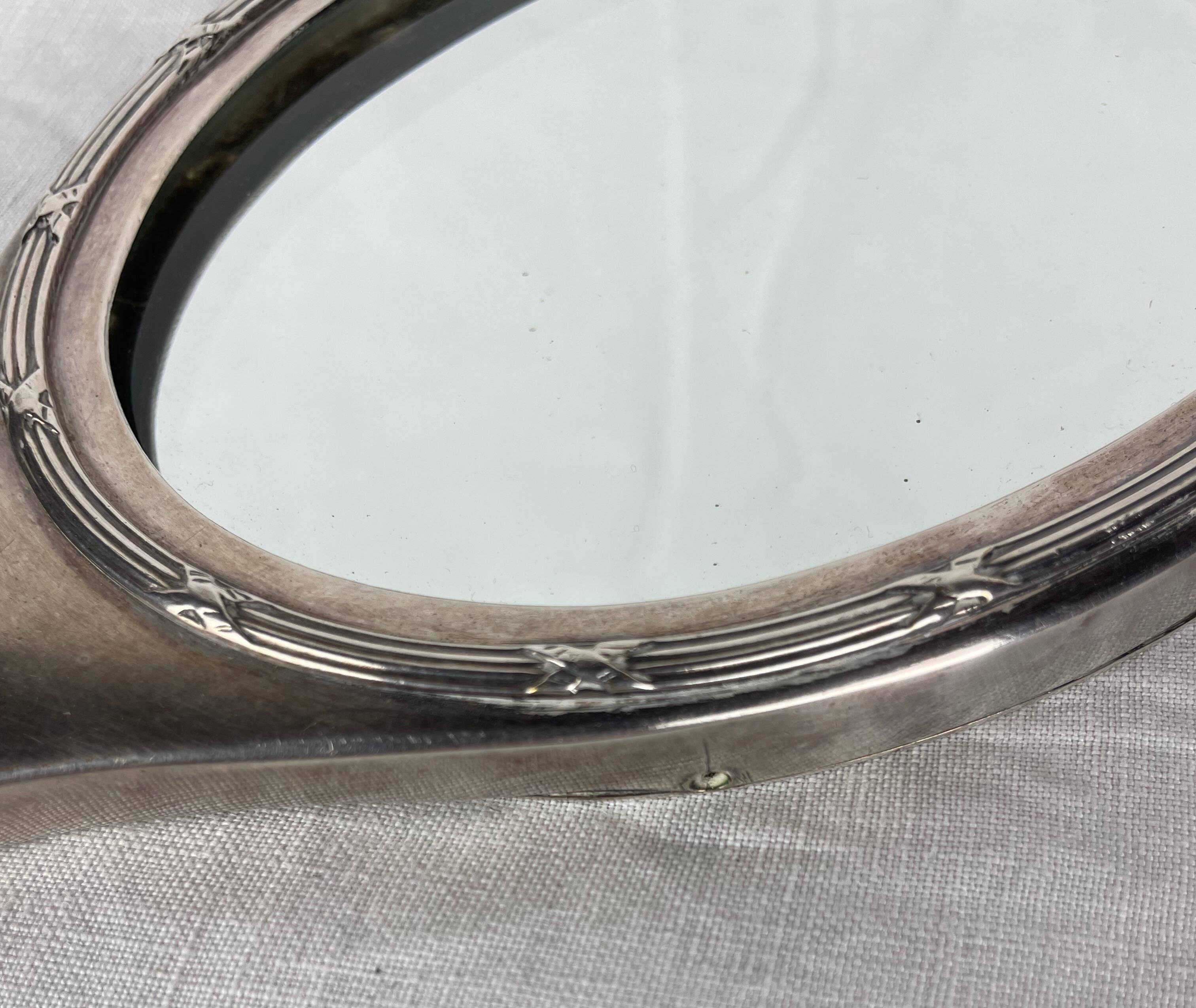 Silver metal hand mirror