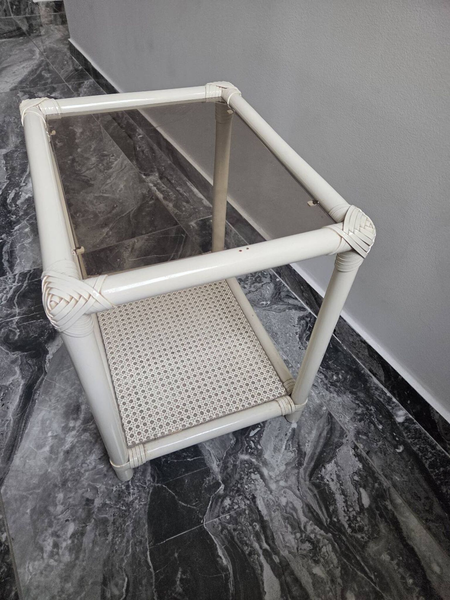 Rattan and cane side table with tinted glass top