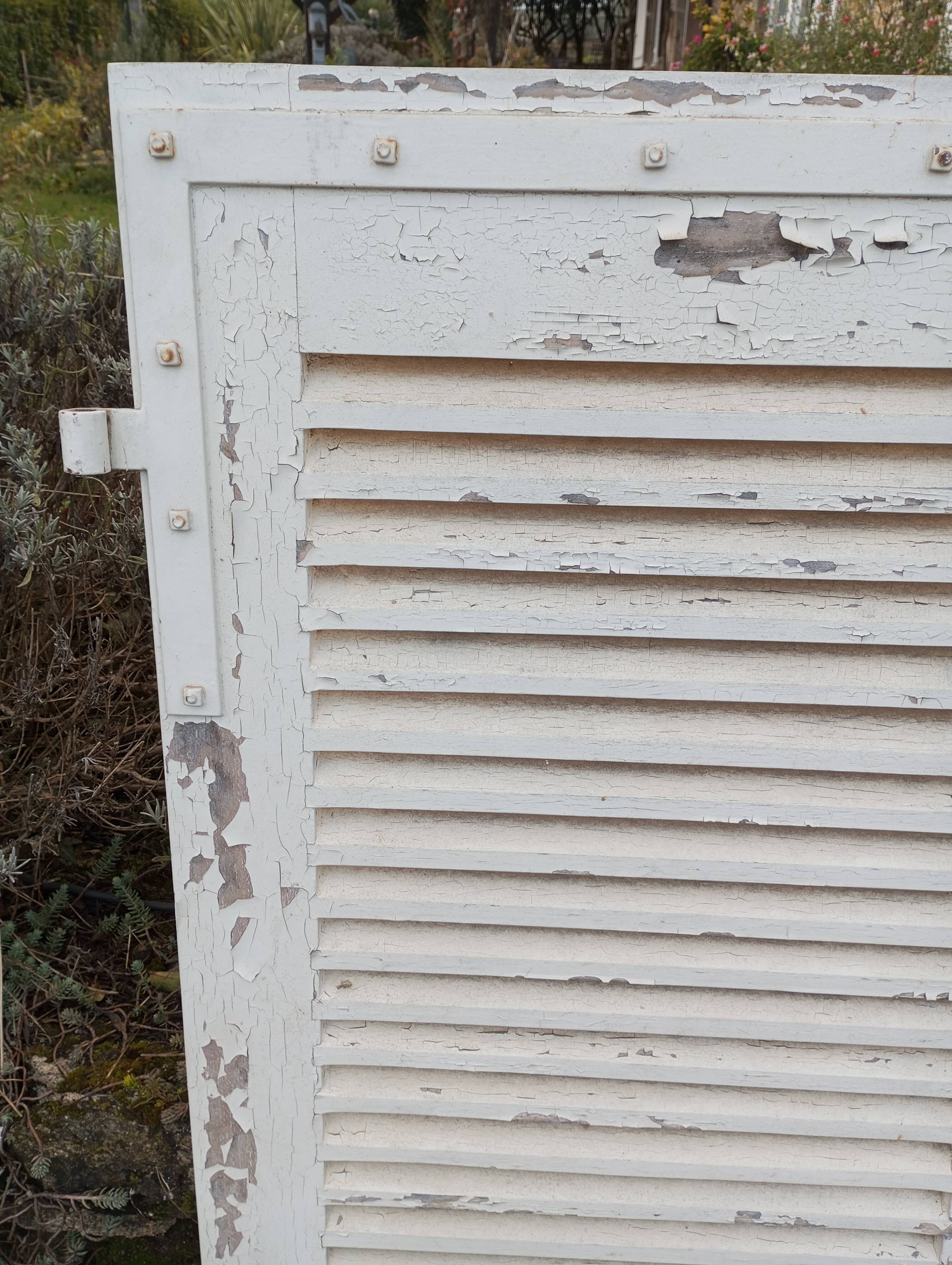 Pair of tropical wood shutters