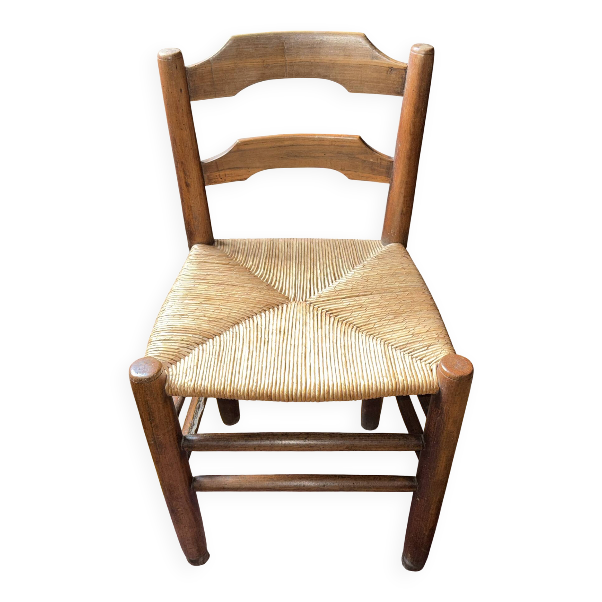 Old rustic wooden armchair – seat in woven rush
