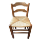 Old rustic wooden armchair – seat in woven rush