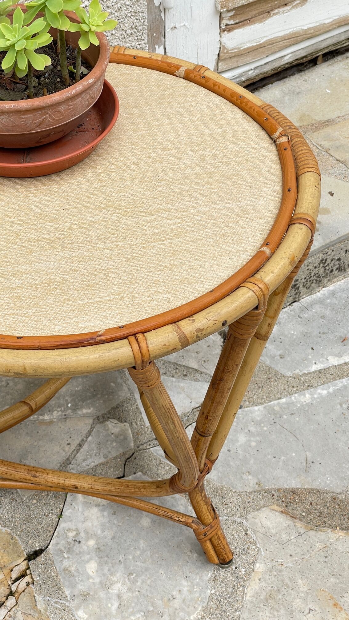 Round coffee table in vintage rattan