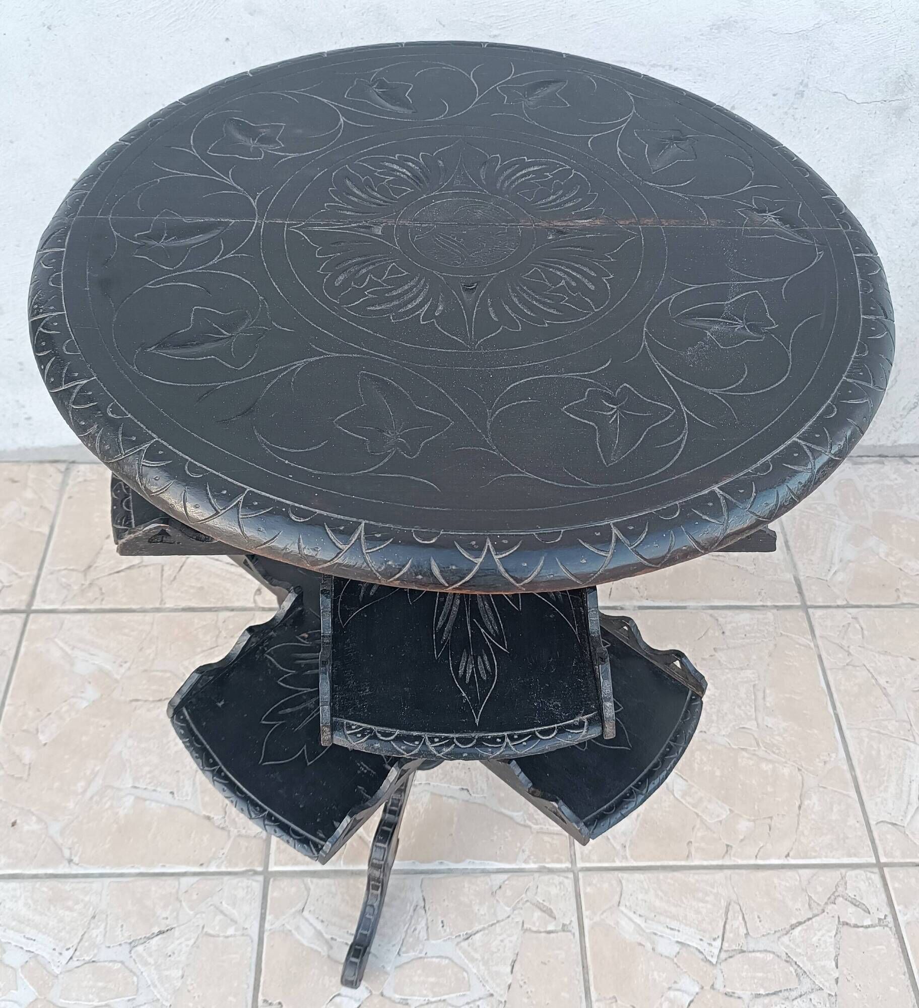 Napoleon III period gueridon in blackened wood.