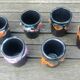Six vintage glazed ceramic glasses