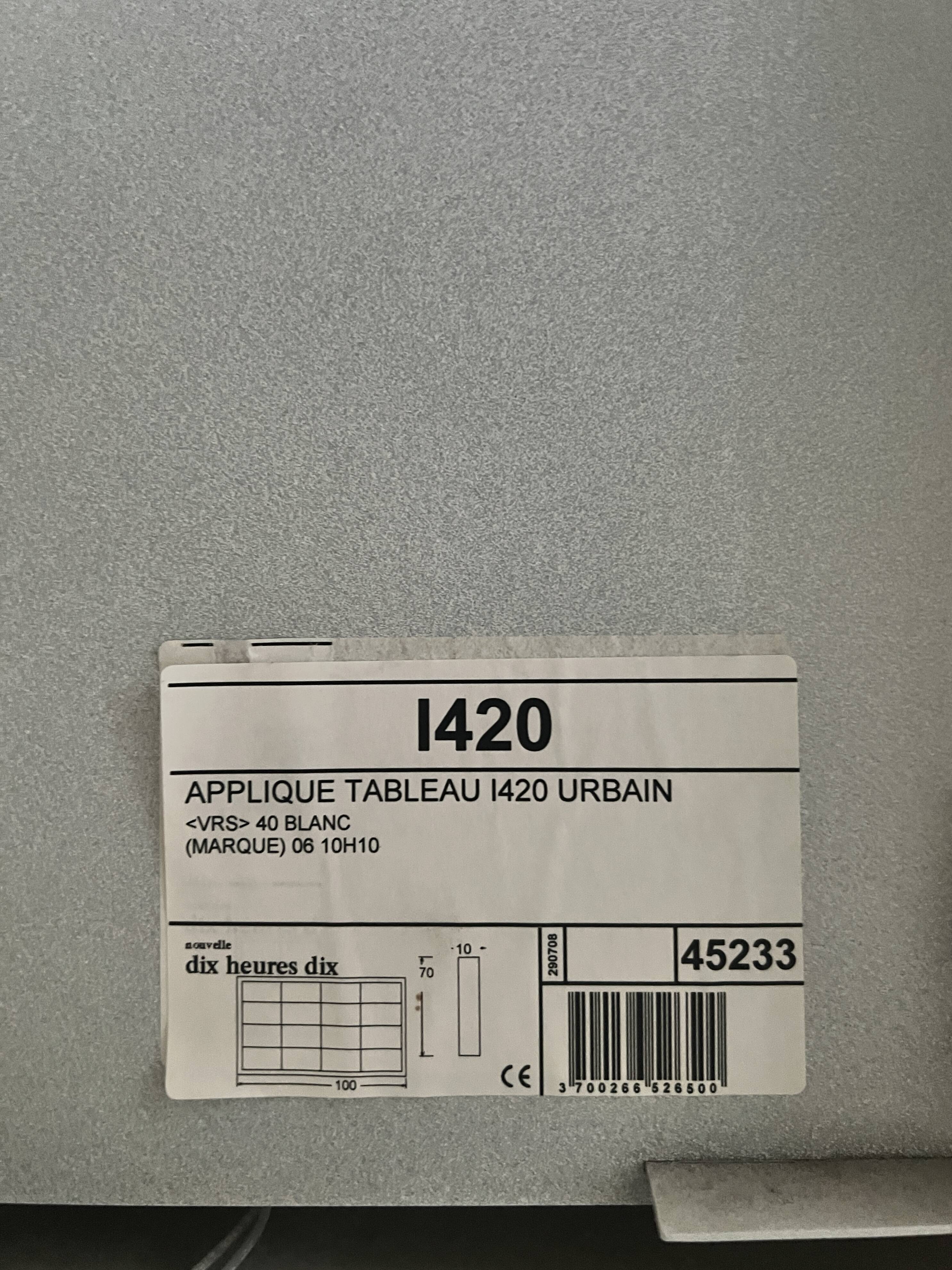 Modernist wall lamp with white metal shade, design by C. Grandidier.