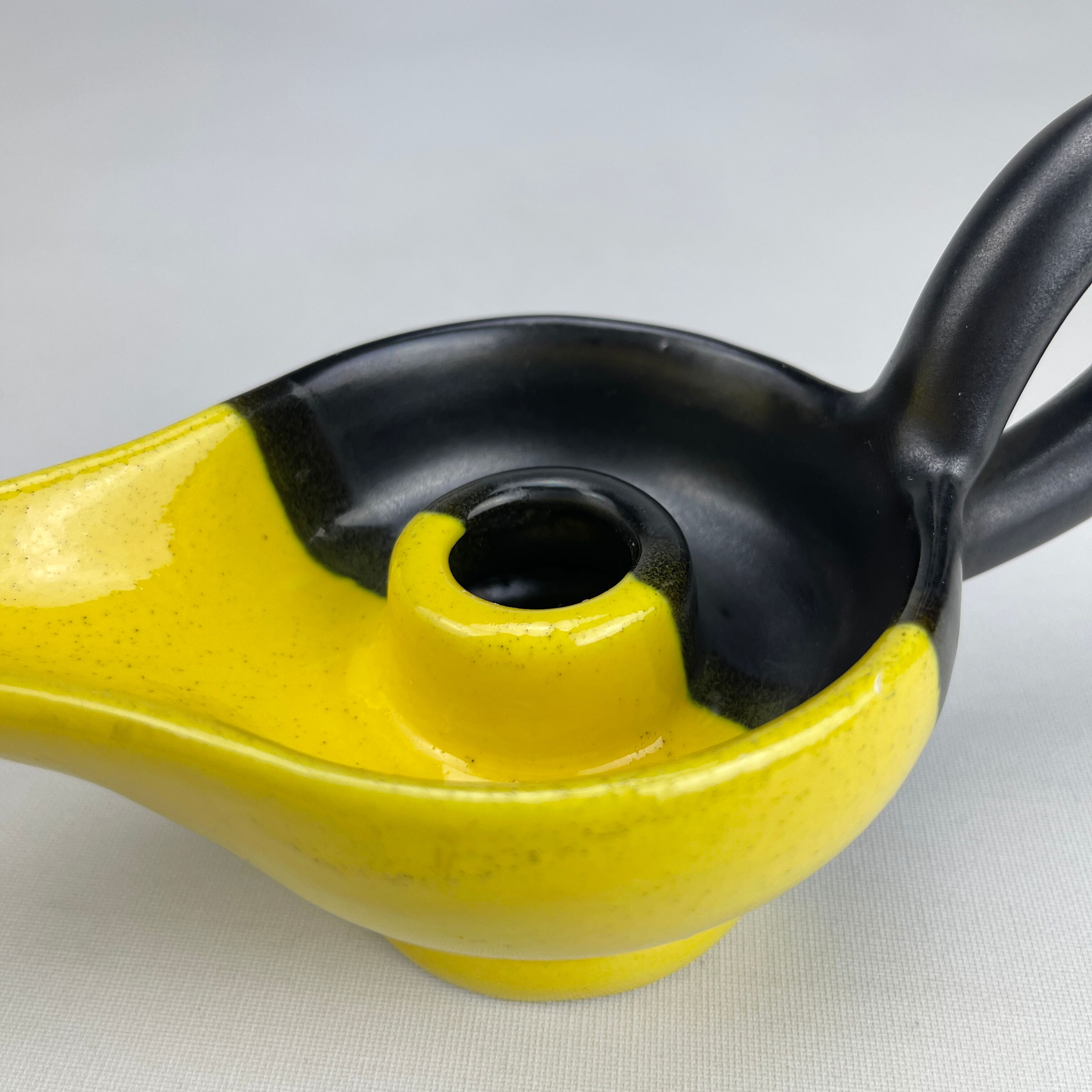 Mid-century yellow and black ceramic cellar rat candle holder