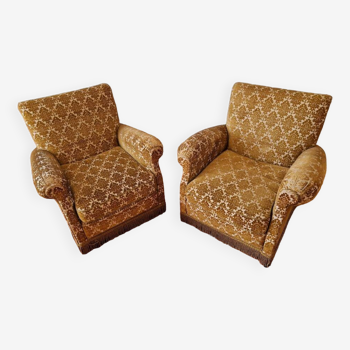 Pair of gold fringed armchairs